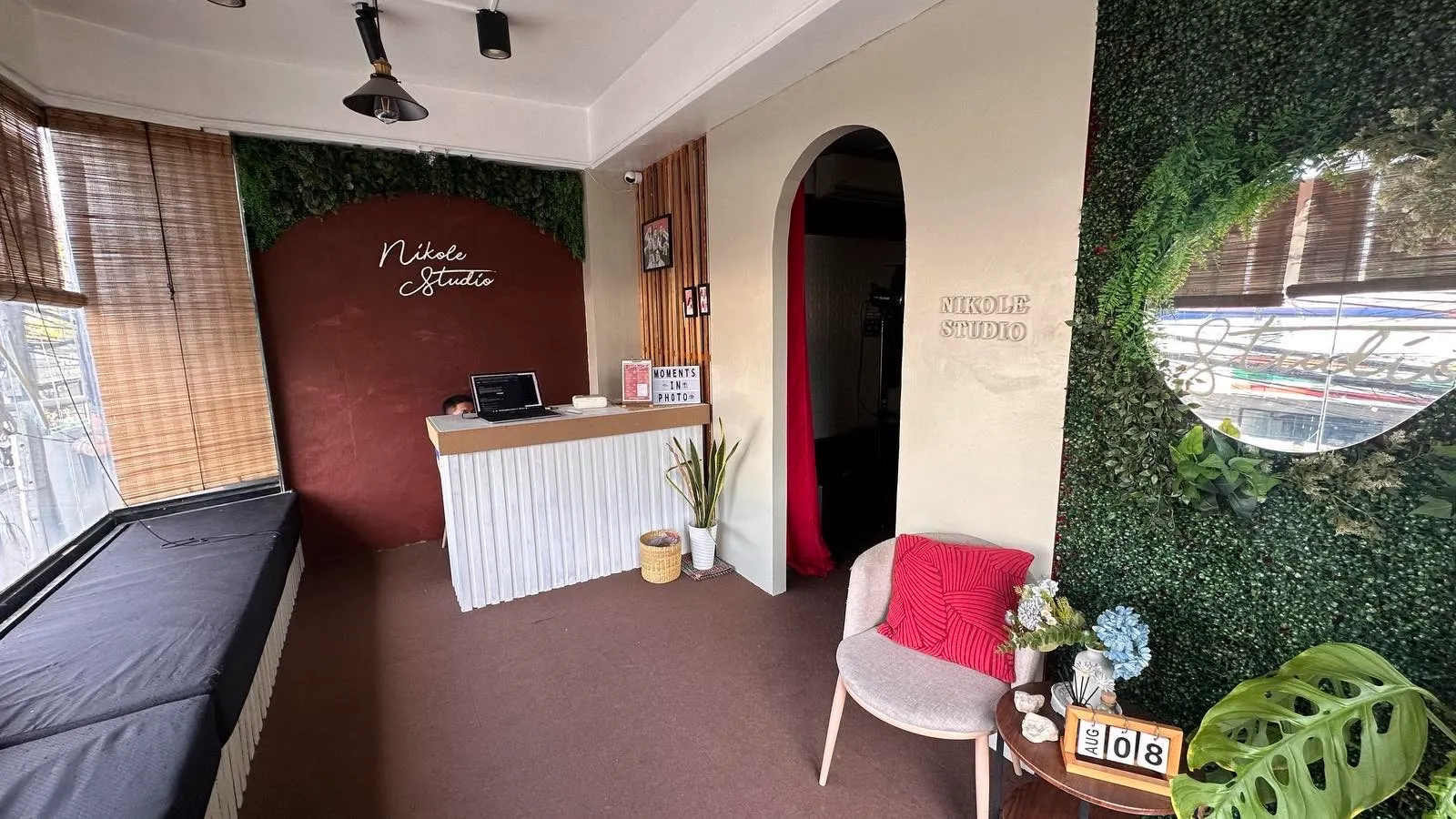 Nikole Studio reception area with terracotta accent wall